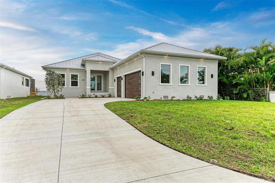Front exterior of a new home in , Punta Gorda, FL, highlighting curb appeal (Image 20). Front exterior of a new home in , Punta Gorda, FL, highlighting curb appeal (Image 20).