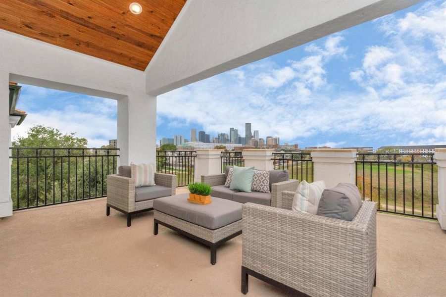 **THIS PHOTO IS OF A PREVIOUS BUILT HOME** THIS HOME WILL BE THE SAME FLOORPLAN BUT WILL HAVE DIFFERENT FINISHES - Unobstructed Views of Downtown Houston from the 4th floor rooftop deck.Imagine evenings on this rooftop deck, sipping a glass of wine while taking in the sunset views of downtown Houston!