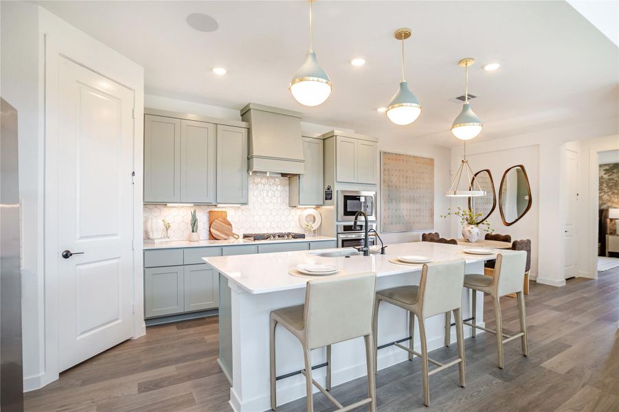 This modern kitchen features sleek cabinetry, a spacious island. The open layout is perfect for entertaining, with stylish decor and ample counter space for cooking. This modern kitchen features sleek cabinetry, a spacious island. The open layout is perfect for entertaining, with stylish decor and ample counter space for cooking.