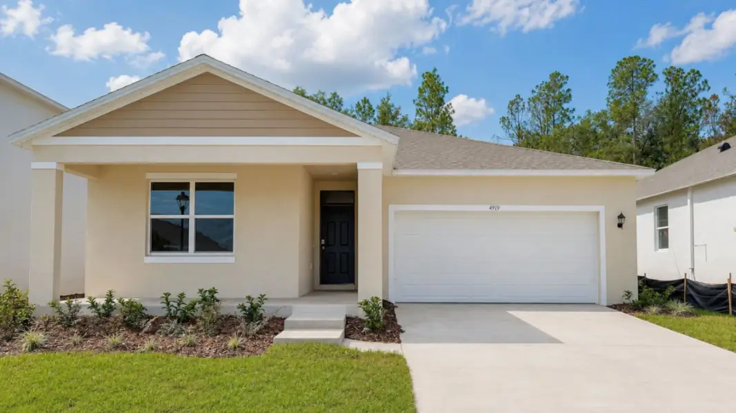 Front exterior of a new home in Preston Cove, St. Cloud, FL, highlighting curb appeal (Image 1). Front exterior of a new home in Preston Cove, St. Cloud, FL, highlighting curb appeal (Image 1).