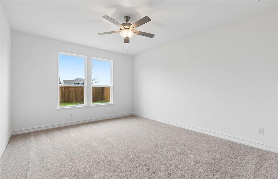 Primary suite with large windows