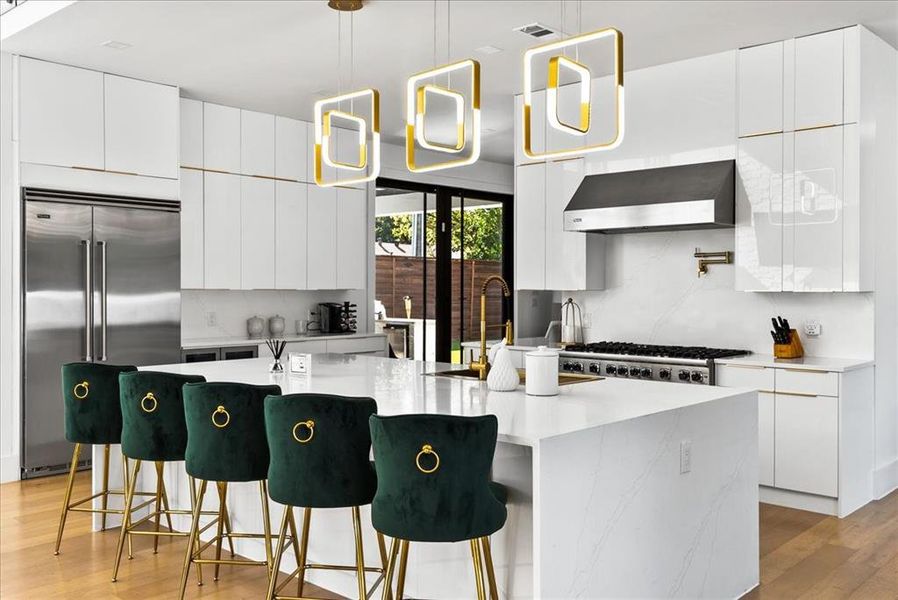 Kitchen with large island, Viking Appliances, white cabinetry, Quartz