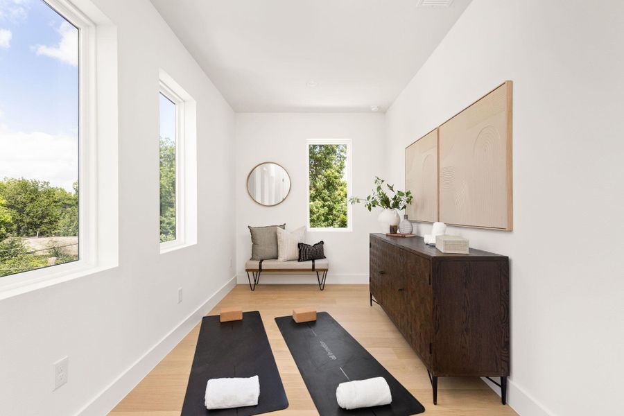 An adaptable bonus room with wood flooring offers tranquil space for exercise or quiet contemplation. An adaptable bonus room with wood flooring offers tranquil space for exercise or quiet contemplation.