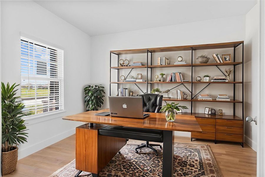 Private home office/study with French glass doors and a large window for natural light — ideal for remote work or reading. *Virtually Staged* **Image Representative of Plan Only and May Vary as Built**.