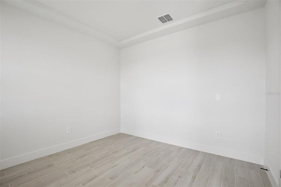 Spacious, unfurnished interior of a new home in Magnolia Bay - Reserve Series, Nokomis (Image 37).