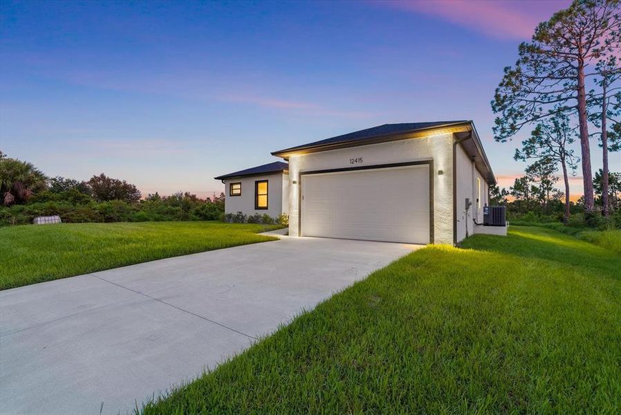 Front exterior of a new home in , Port Charlotte, FL, highlighting curb appeal (Image 27). Front exterior of a new home in , Port Charlotte, FL, highlighting curb appeal (Image 27).