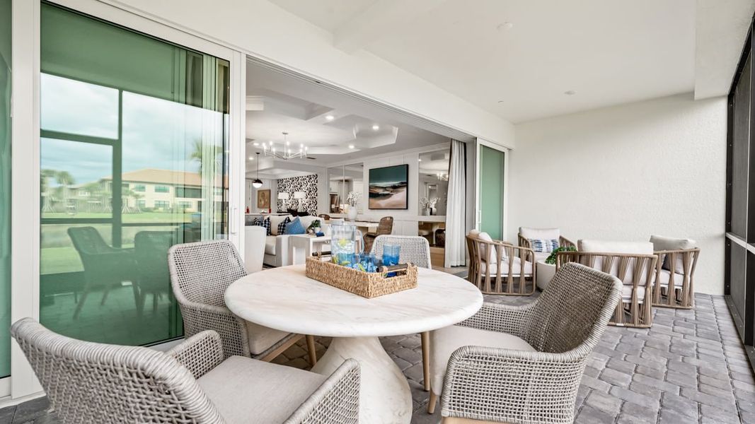 Exterior details and patio area of a home in Esplanade by the Islands Coach Homes, Naples (Image 17).