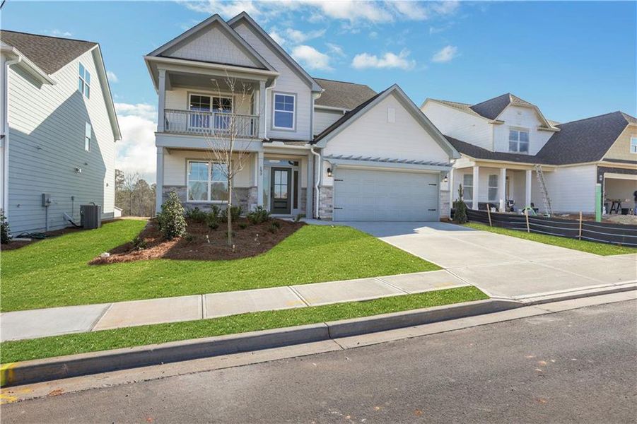 Front exterior of a new home in Twin Lakes, Hoschton, GA, highlighting curb appeal (Image 24).