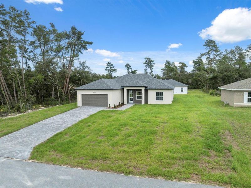 Front exterior of a new home in , Ocala, FL, highlighting curb appeal (Image 28).