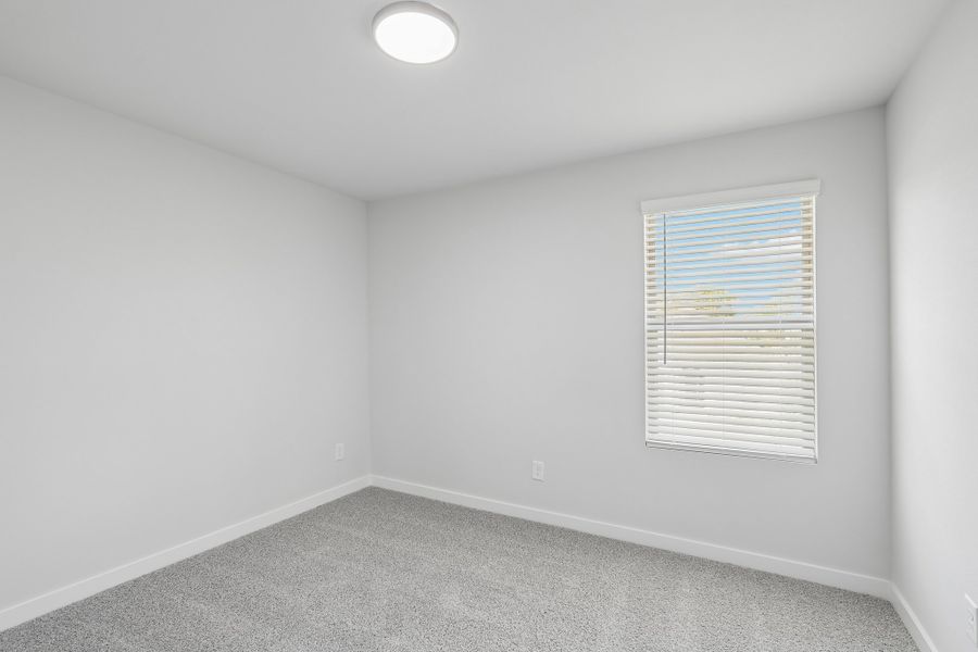Bedroom in the Holden home plan by Trophy Signature Homes