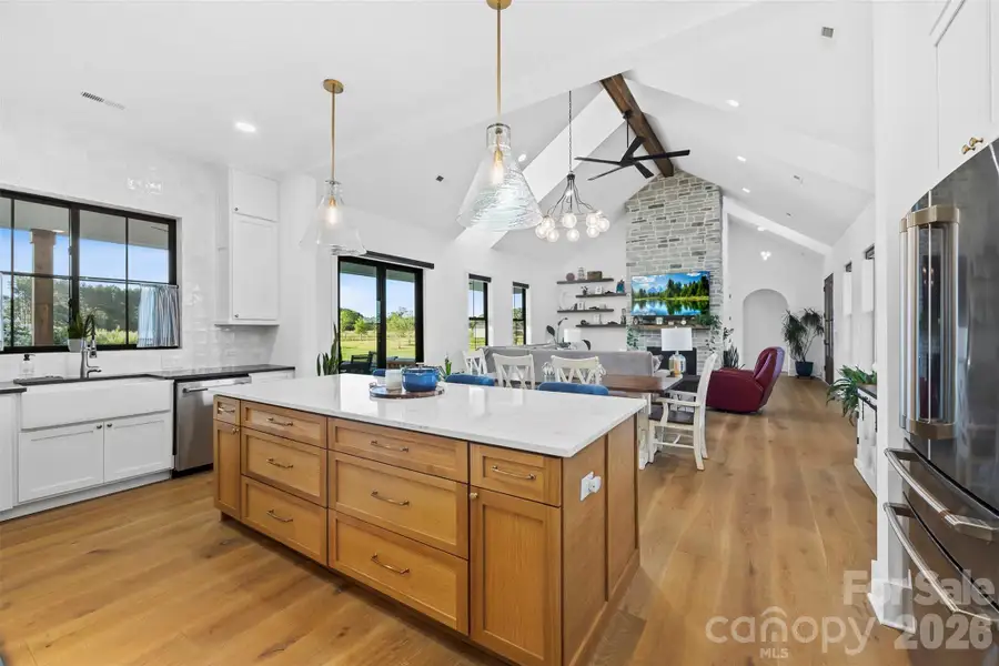Open concept living with gourmet kitchen and oversized island.