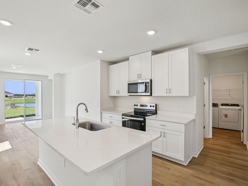 Furnished interior view inside a new home in Magnolia Bay - Premier Series, Nokomis (Image 4).