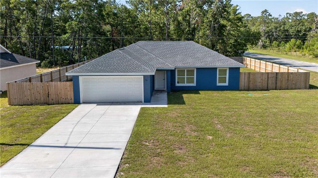 Front exterior of a new home in , Ocklawaha, FL, highlighting curb appeal (Image 24).