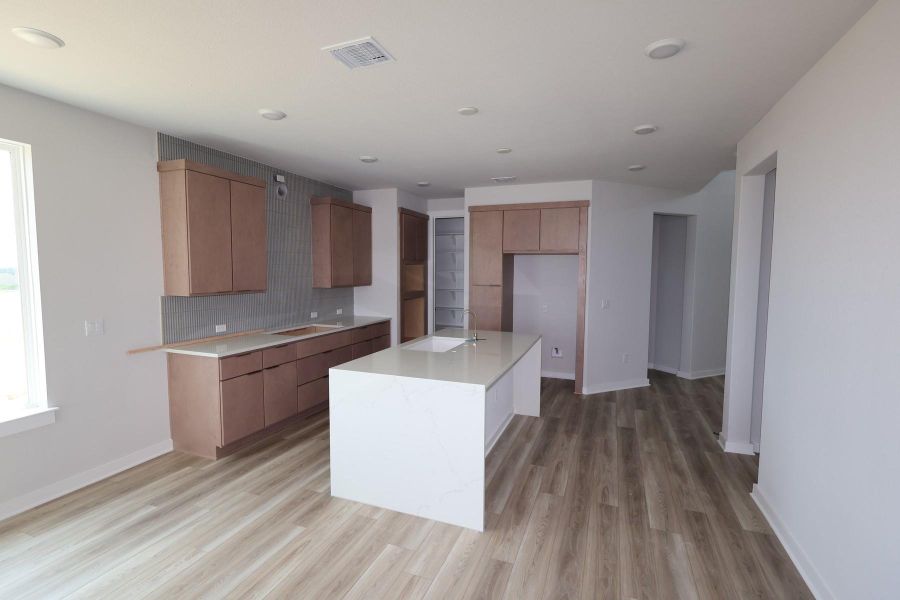 Furnished interior view inside a new home in Terrace Collection At Turner's Crossing, Buda (Image 6).