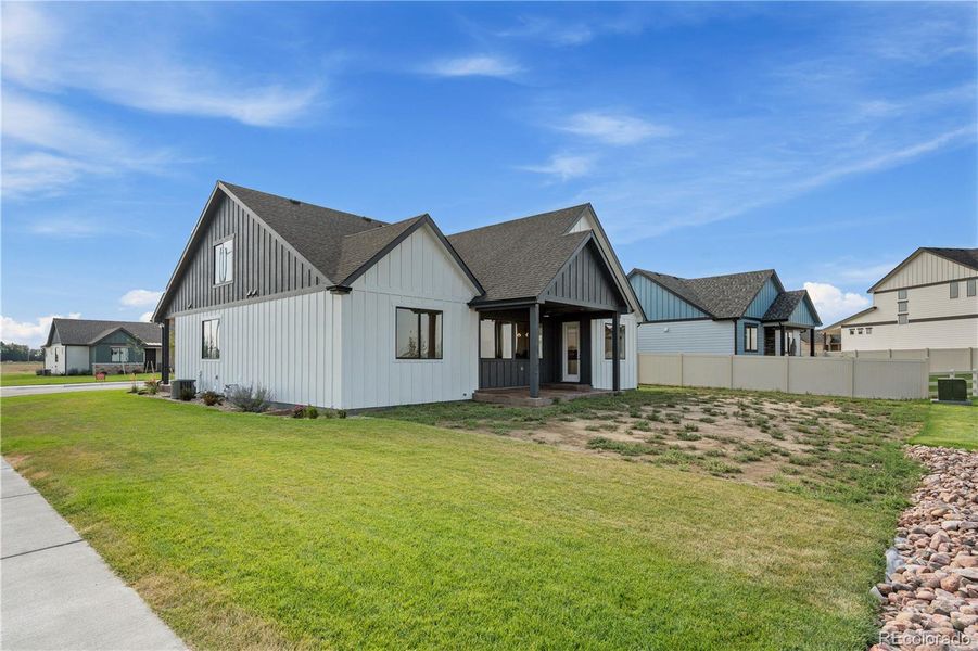 Front exterior of a new home in , Fort Morgan, CO, highlighting curb appeal (Image 23).