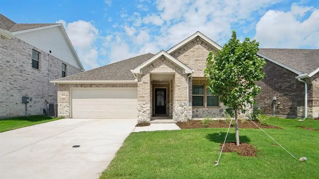 Front exterior of a new home in Windmore, Princeton, TX, highlighting curb appeal (Image 1).