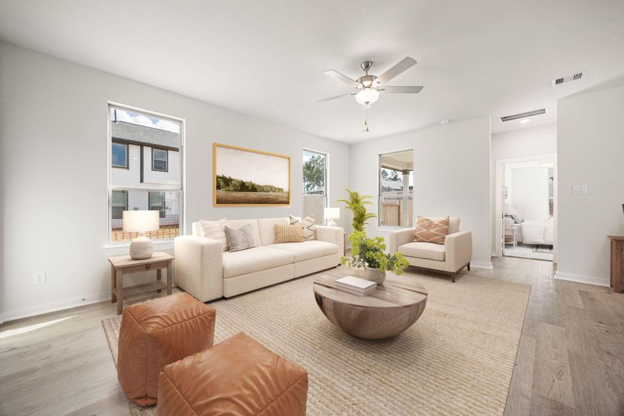 This modern open-concept layout features a seamless connection between the kitchen, dining, and living spaces. Light-toned flooring, recessed lighting, and neutral finishes create a bright, welcoming atmosphere that feels both spacious and refined. This modern open-concept layout features a seamless connection between the kitchen, dining, and living spaces. Light-toned flooring, recessed lighting, and neutral finishes create a bright, welcoming atmosphere that feels both spacious and refined.