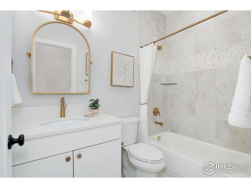 Full guest bathroom with modern fixtures.