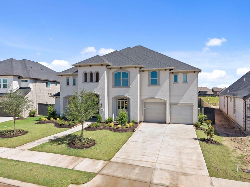 Front exterior of a new home in Harvest Green, Richmond, TX, highlighting curb appeal (Image 23).