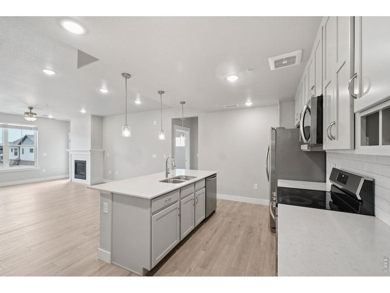 Furnished interior view inside a new home in Highlands at Fox Hill - The Flats, Longmont (Image 9).