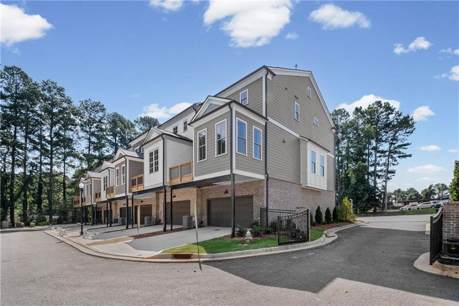 Front exterior of a new home in Devin's Shire, Kennesaw, GA, highlighting curb appeal (Image 21).