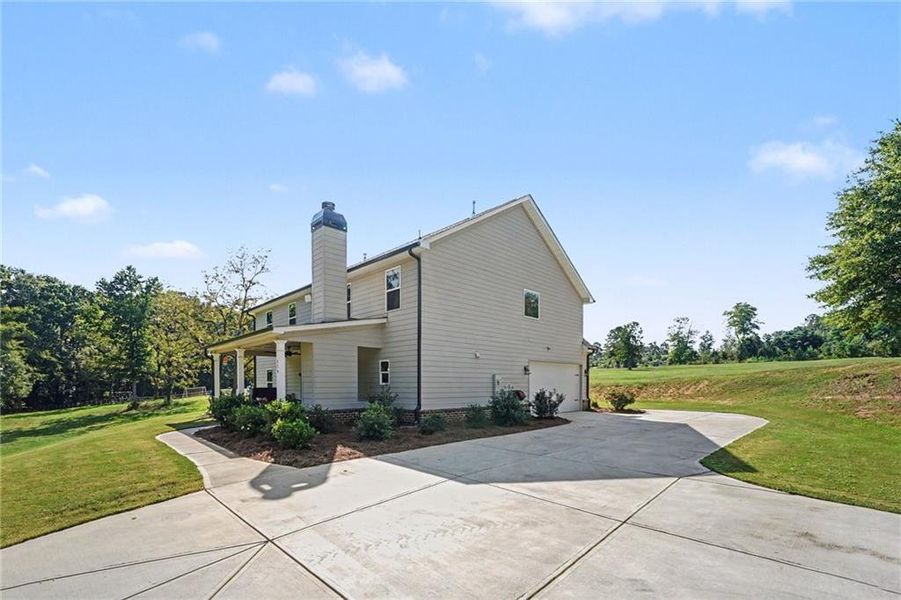 Front exterior of a new home in , Covington, GA, highlighting curb appeal (Image 24). Front exterior of a new home in , Covington, GA, highlighting curb appeal (Image 24).