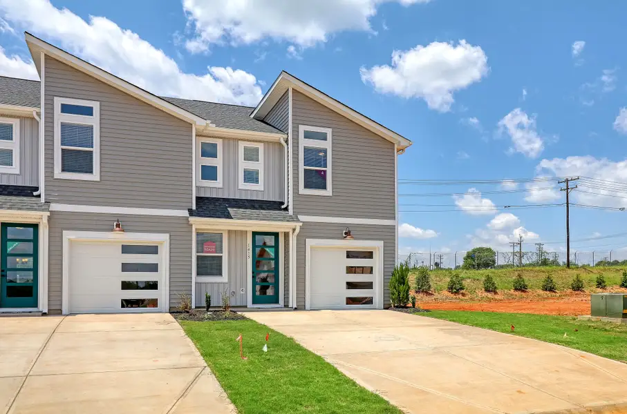 Representative exterior photo of a completed home built from the Raycord by Hunter Quinn Homes in Westgate Village Townes, Spartanburg, SC (Image 19). Representative exterior photo of a completed home built from the Raycord by Hunter Quinn Homes in Westgate Village Townes, Spartanburg, SC (Image 19).