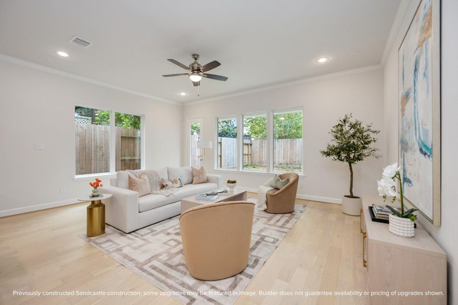 Bask in the warmth of the living room, where neutral light walls and exquisite light wood floors craft an ambiance of understated elegance. Bask in the warmth of the living room, where neutral light walls and exquisite light wood floors craft an ambiance of understated elegance.