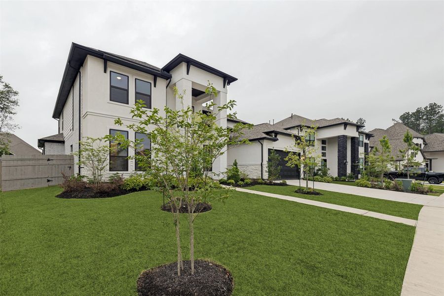 Front exterior of a new home in , Conroe, TX, highlighting curb appeal (Image 26).