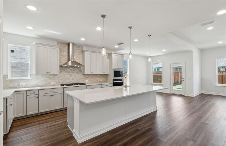 Bright kitchen with large island *real home pictured