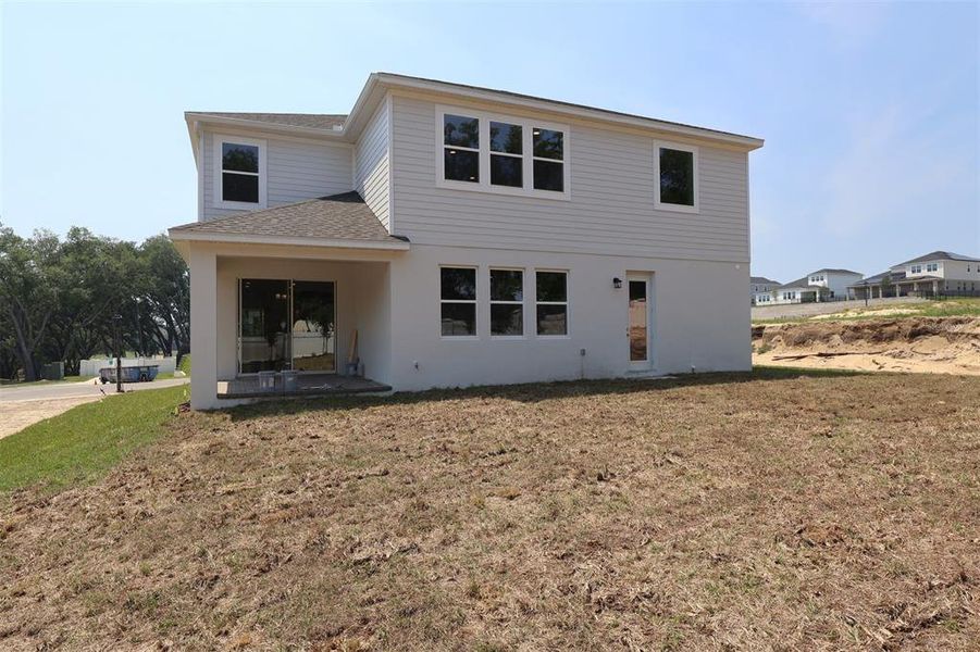 Exterior details and patio area of a home in Wolf Lake Ranch, Apopka (Image 3).