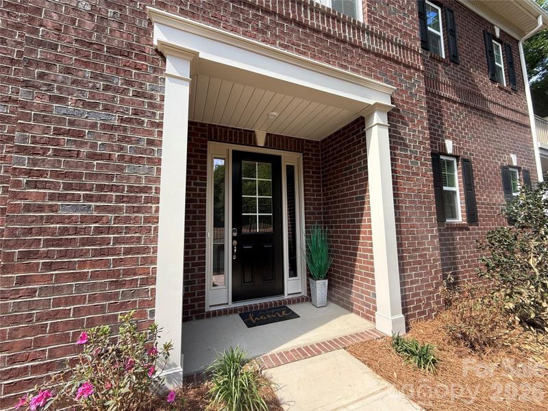 Exterior details and patio area of a home in The Townes at Wade Ardrey, Charlotte (Image 27).