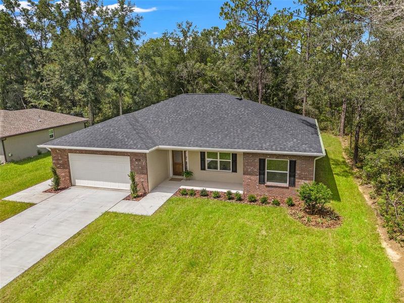 Front exterior of a new home in , Citrus Springs, FL, highlighting curb appeal (Image 2).