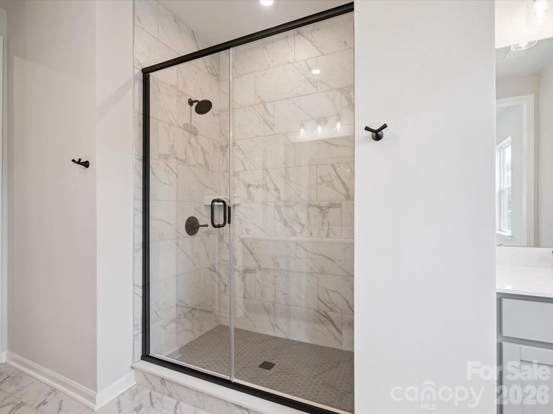 Tiled primary walk-in shower