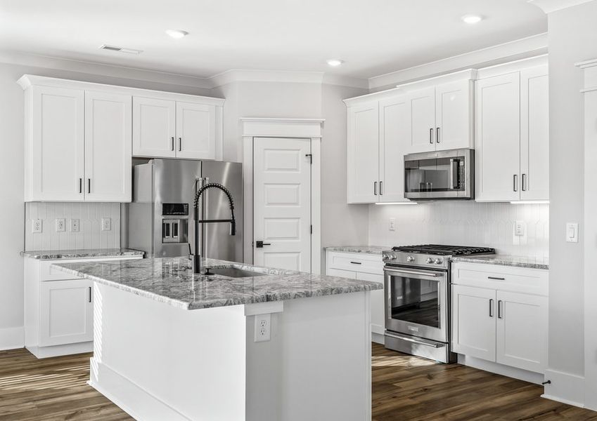 The kitchen has a large oversize island.