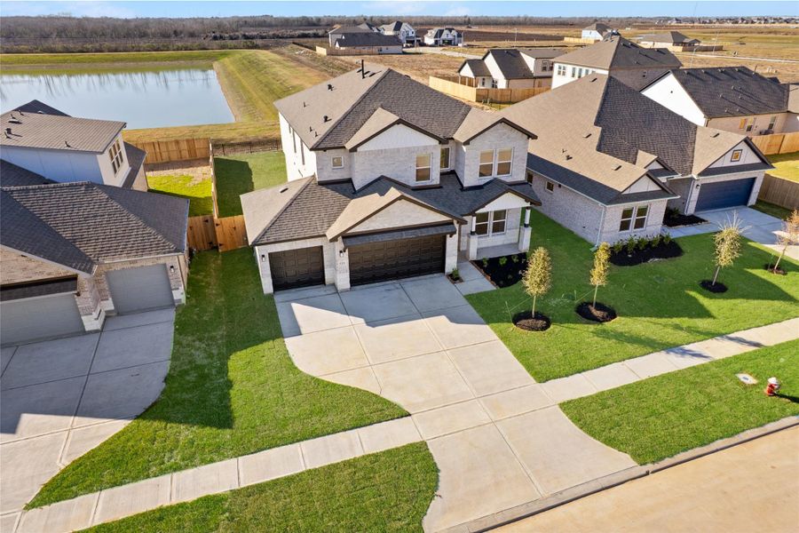 Front exterior of a new home in , Manvel, TX, highlighting curb appeal (Image 21).