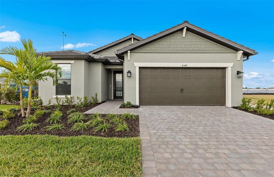 Front exterior of a new home in , North Port, FL, highlighting curb appeal (Image 2). Front exterior of a new home in , North Port, FL, highlighting curb appeal (Image 2).