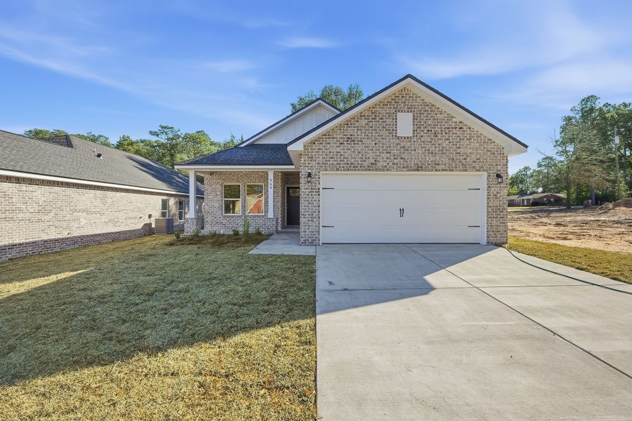 Front exterior of a new home in McCarthy Estates, Defuniak Springs, FL, highlighting curb appeal (Image 1). Front exterior of a new home in McCarthy Estates, Defuniak Springs, FL, highlighting curb appeal (Image 1).