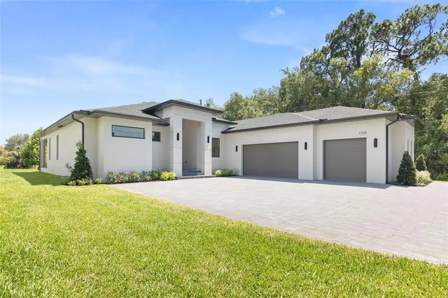 Front exterior of a new home in , Tarpon Springs, FL, highlighting curb appeal (Image 1). Front exterior of a new home in , Tarpon Springs, FL, highlighting curb appeal (Image 1).