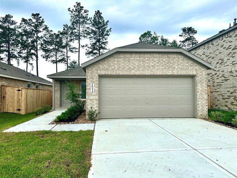 Front exterior of a new home in Windrose Green, Angleton, TX, highlighting curb appeal (Image 2).