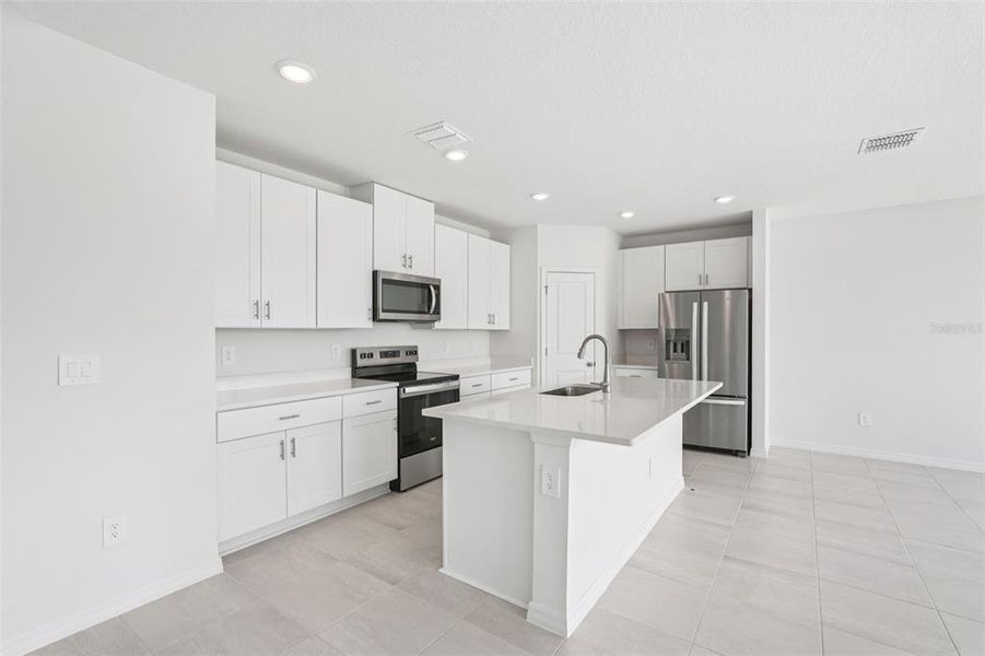 Furnished interior view inside a new home in Salt Meadows - Classic Series, Parrish (Image 5). Furnished interior view inside a new home in Salt Meadows - Classic Series, Parrish (Image 5).