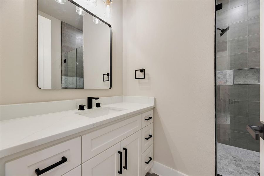 Full bath with vanity and a walk in shower