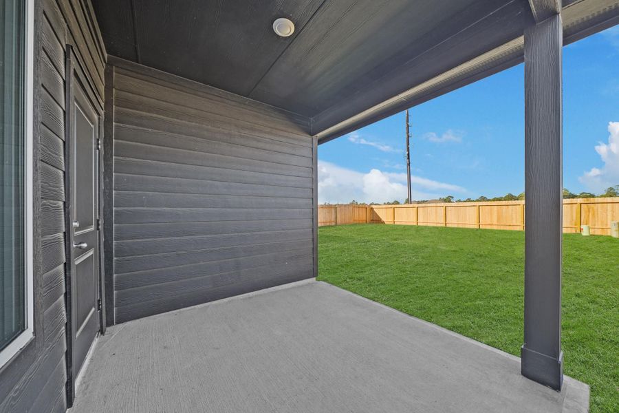 Exterior details and patio area of a home in Grand Pines, Magnolia (Image 3).