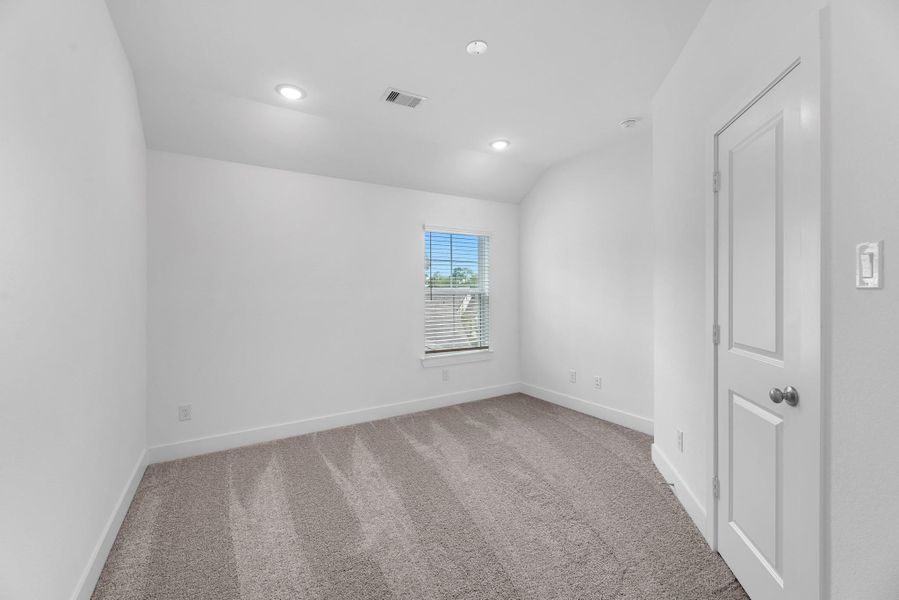 Well-appointed secondary bedroom offering ample closet space and plenty of natural light.