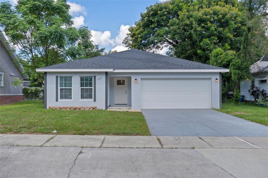 Front exterior of a new home in , Winter Haven, FL, highlighting curb appeal (Image 29). Front exterior of a new home in , Winter Haven, FL, highlighting curb appeal (Image 29).