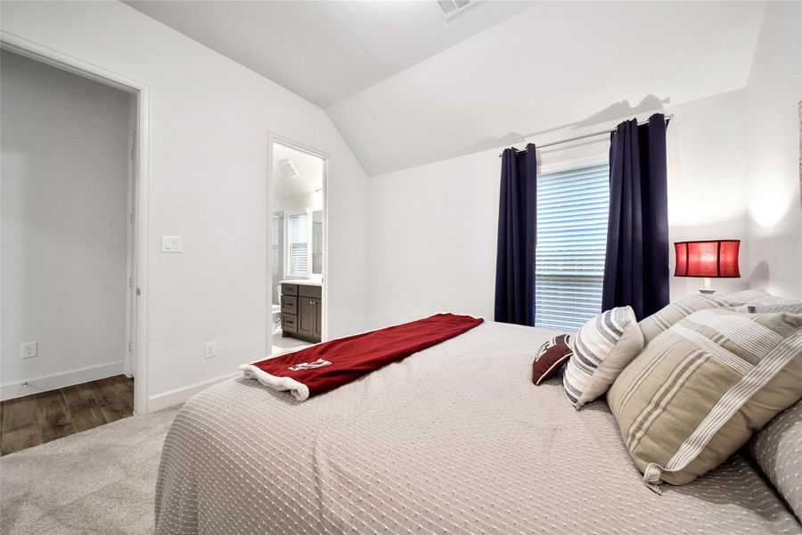 Private guest bedroom features its own ensuite bath—an ideal setup for overnight guests or family members.