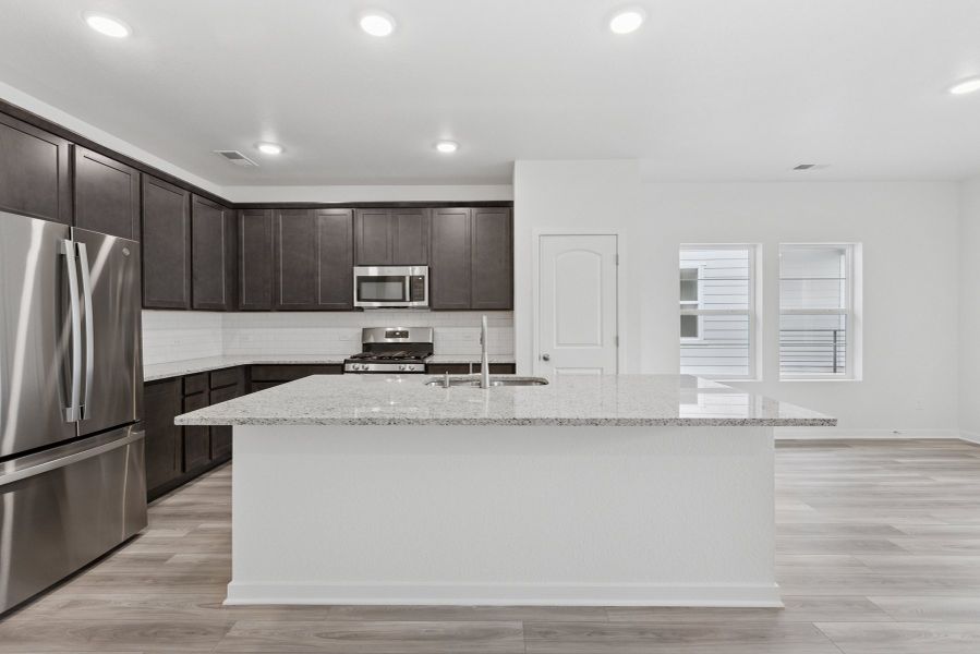 Furnished interior view inside a new home in Kinston Mainstreet Townhomes, Loveland (Image 6). Furnished interior view inside a new home in Kinston Mainstreet Townhomes, Loveland (Image 6).