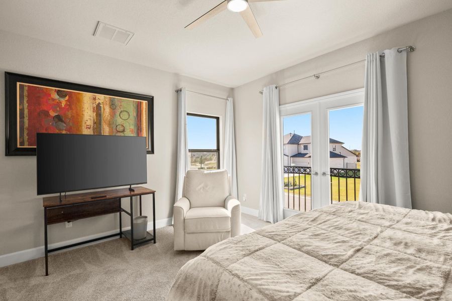 Bedroom with light carpet, access to outside, and ceiling fan Bedroom with light carpet, access to outside, and ceiling fan