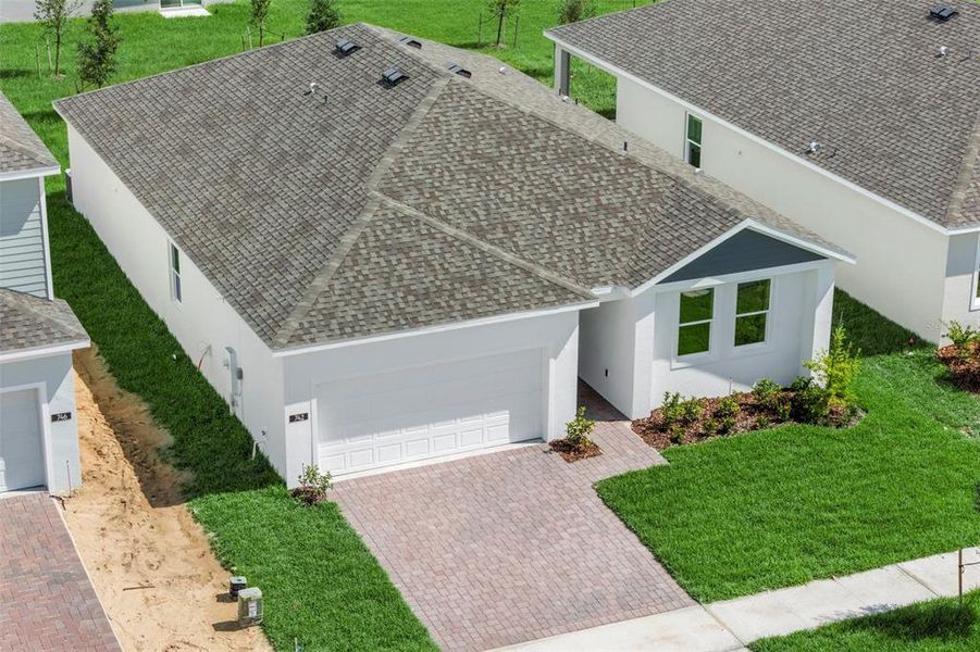 Front exterior of a new home in Marion Ridge, Haines City, FL, highlighting curb appeal (Image 2).