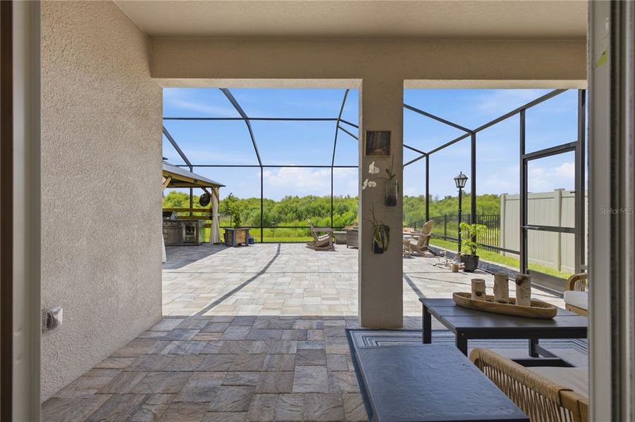 Exterior details and patio area of a home in Farm at Varrea, Plant City (Image 37).